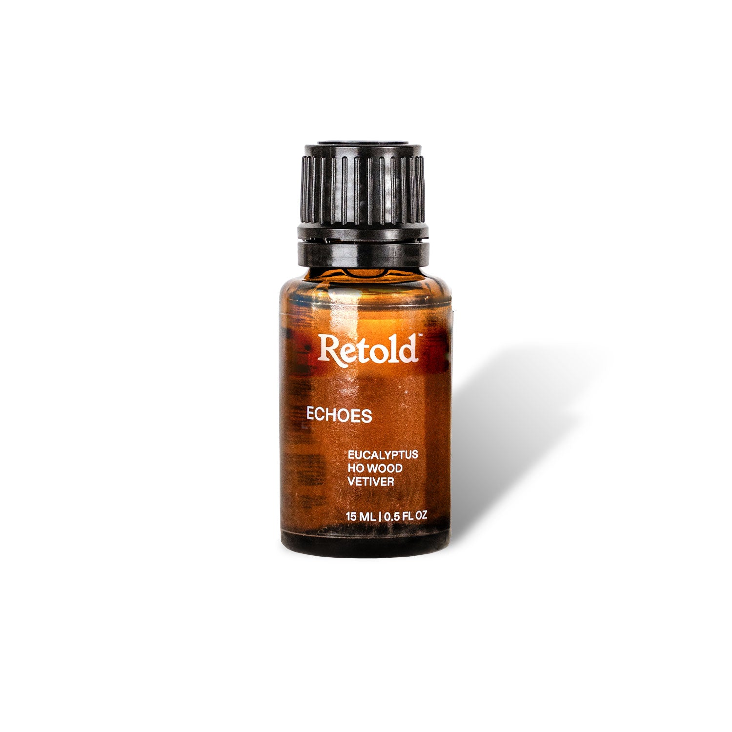 A brown glass bottle with a black cap labeled 'ECHOES' by Retold, containing aroma oil blend.